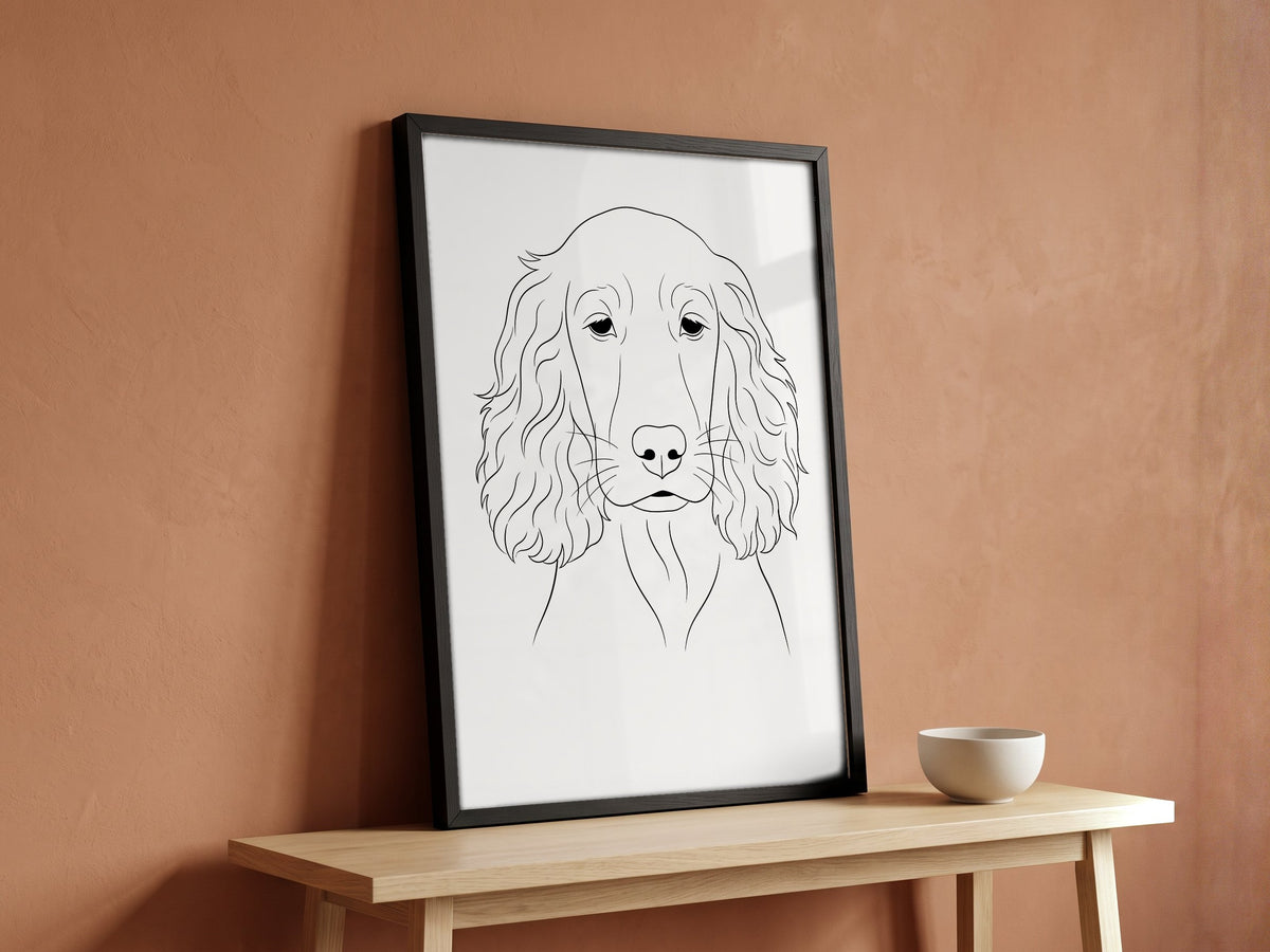 Line art dog portrait as a framed fine-art poster in a black wood frame, leaning on an oak bench against a terracotta wall